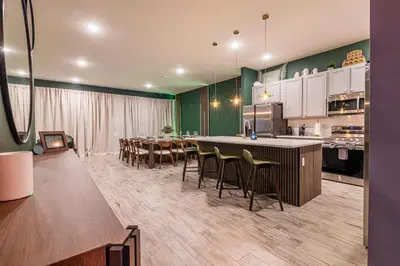 a kitchen and dining room with a table and chairs at Disney Dream House com 12 Themed Bedrooms 5851 in Orlando