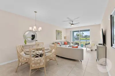 a living room with a couch and a table at 3141-104 Resort Lake View Disney Universal Orlando in Kissimmee