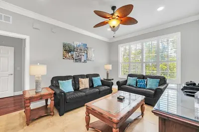 a living room with a couch and a table at Serene 3 Bedroom Retreat in Orlando6494 in Orlando