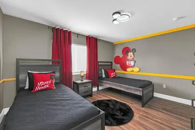 a bedroom with a bed and a bed and a window at Dreamy 6 Bedroom Villa in Orlando6495 in Orlando