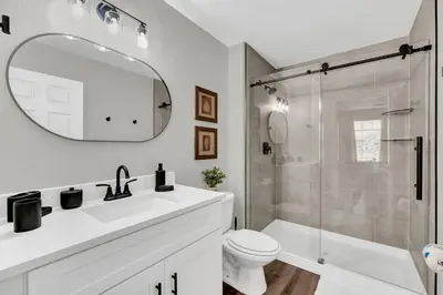 a bathroom with a sink and a toilet and a shower at Dreamy 6 Bedroom Villa in Orlando6495 in Orlando