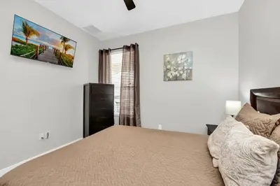 a bedroom with a bed and a window at Dreamy 6 Bedroom Villa in Orlando6495 in Orlando