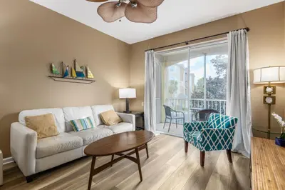 a living room with a couch and a table at Stunning 2 Bedroom Retreat in Orlando6496 in Orlando