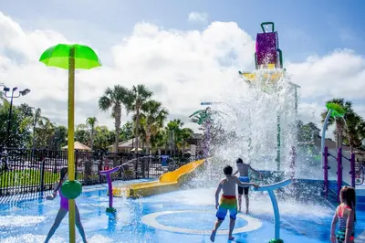 a group of children playing in a water park at Stunning 2 Bedroom Retreat in Orlando6496 in Orlando