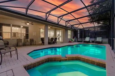 a swimming pool with a glass roof and a patio at Charming Orlando Villa with 5 Bedrooms6499 in Orlando