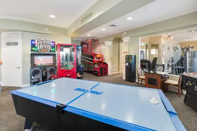 a pool table in a room with arcade games at Orlando Dream Home - 4 Bed Villa6501 in Orlando