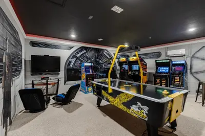 a gaming room with a pool table and arcade machines at Orlando Oasis: 5 Bed Villa6504 in Orlando
