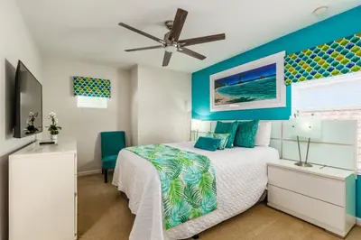 a bedroom with a bed and a ceiling fan at Orlando Oasis: 5 Bed Villa6504 in Orlando
