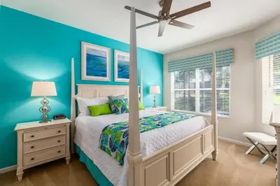 a bedroom with a bed and a ceiling fan at Orlando Oasis: 5 Bed Villa6504 in Orlando