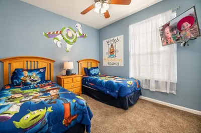 a bedroom with two beds and a ceiling fan at Orlando Paradise: 3 Bed Condo6505 in Orlando