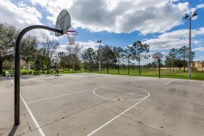 an empty basketball court with a hoop at Orlando Paradise: 3 Bed Condo6505 in Orlando
