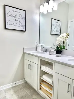 a bathroom with a sink and a mirror at Luxury 2bd 2 bath Condo Home 250 in Kissimmee