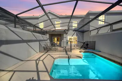 a swimming pool in the middle of a house at Heated pool Lazy River Mini Golf Near Disney Resort in Kissimmee