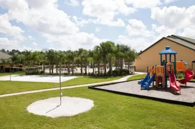 a playground at a park with a slide at PP8962 - 4 Bedrooms w Pool & Resort Access in Kissimmee