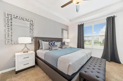 a bedroom with a bed and a window at The Ultimate Mansion on Solara Resort Orlando Mansion 5304 in Kissimmee