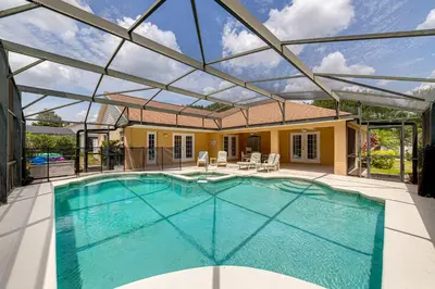 an indoor swimming pool with a glass ceiling at 514 - Make Yourself at Home on our Private Pool Deck with Spa in Orlando