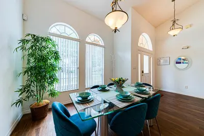 a dining room with a table and chairs at 514 - Make Yourself at Home on our Private Pool Deck with Spa in Orlando