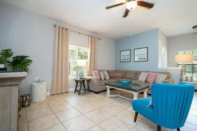 a living room with a couch and a table at Themed 5Bd Paradise Palms Close to Disney w Pool 8951 in Kissimmee