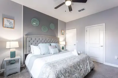 a bedroom with a bed and a ceiling fan at Star Wars & Harry Potter Villa with Pool & Hot Tub in Kissimmee