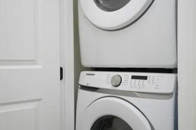 a washing machine and a dryer in a room at BRAND NEW Cozy 3BR Margaritaville in Orlando