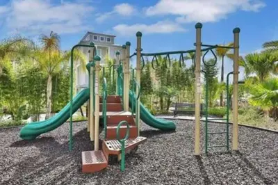 a playground with a slide in a park at BRAND NEW Cozy 3BR Margaritaville in Orlando