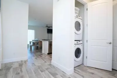 a white laundry room with a washer and dryer at BRAND NEW Private Oasis 4 BR - Margaritaville in Orlando