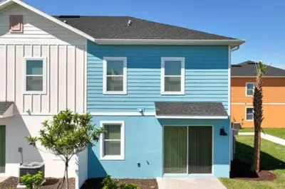 a blue house with a white at BRAND NEW Private Oasis 4 BR - Margaritaville in Orlando