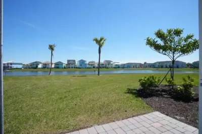 a park with a tree in the middle of a field at BRAND NEW Private Oasis 4 BR - Margaritaville in Orlando