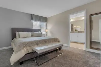 a bedroom with a large bed and a large mirror at Storey Lake Resort 5BD Private Pool Close to Disne in Kissimmee