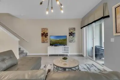 a living room with a couch and a table at Storey Lake Resort 5BD Private Pool Close to Disne in Kissimmee