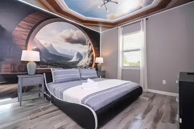 a bedroom with a large painting on the ceiling at Stunning 15 suites close to Disney in Kissimmee
