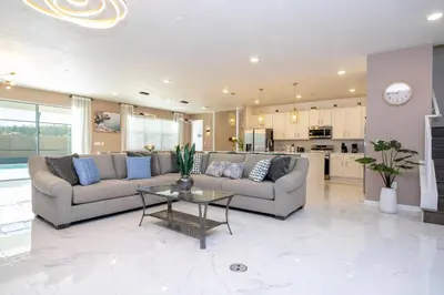 a living room with two couches and a table at Stunning 15 suites close to Disney in Kissimmee