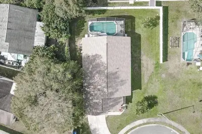 an overhead view of a building with a swimming pool at Private Pool Home Near Disney & Universal Studios in Kissimmee