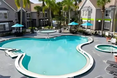 an image of a pool at a resort at Whimsical Condo 1.5M from Disney in Orlando