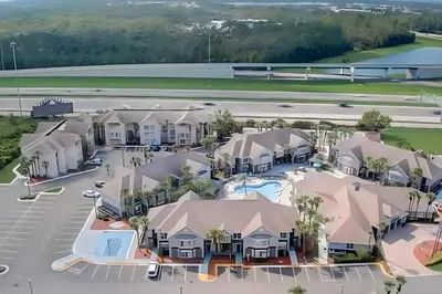 an artist rendering of the proposed apartment complexes at a subdivision at Whimsical Condo 1.5M from Disney in Orlando