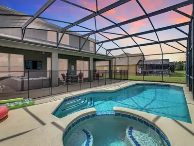 a large swimming pool with a glass roof at 7BR Villa in Emerald Island w/ Resort Perks in Kissimmee