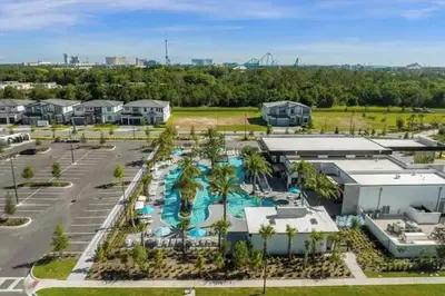 an aerial view of a resort with a swimming pool at Luxurious 15BR Villa with Lake View & Game/Theater in Orlando