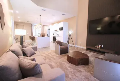 a living room with a couch and a coffee table at NEW Luxury Oasis at Magic Village in Kissimmee