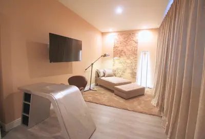 a living room with a couch and a tv at NEW Luxury Oasis at Magic Village in Kissimmee