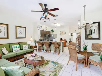 a living room with a couch and a table at Adventureland Oasis - Resort Near Disney in Kissimmee
