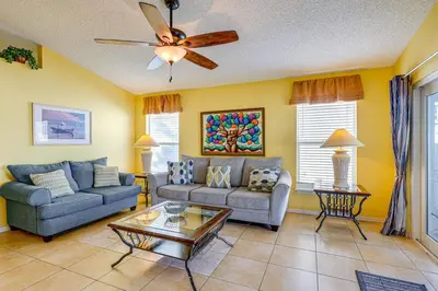 a living room with two couches and a ceiling fan at 9 Mi to Walt Disney World Family Home with Pool! in Orlando