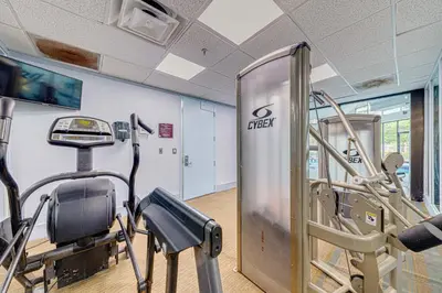 a gym with a treadmill and a tread machine at Cozy Lakeview Getaway Near Universal Studios 2602 in Orlando