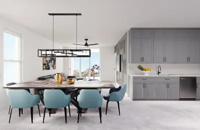 a kitchen with a dining table and blue chairs at Villatel Orlando Resort, Apartments by Marriott Bonvoy in Orlando