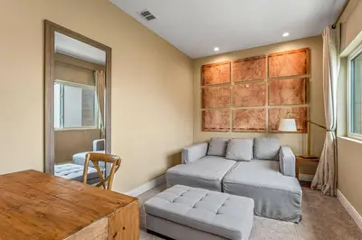 a living room with a couch and a table at Casa 4Q Elegante Perto da Disney – Magic Village in Orlando