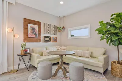 a living room with a couch and a table at Great Outdoor Area in Orlando