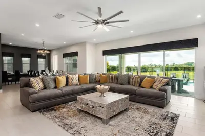 a living room with a couch and a table at The Nicklaus View Haven-TB007 in Orlando