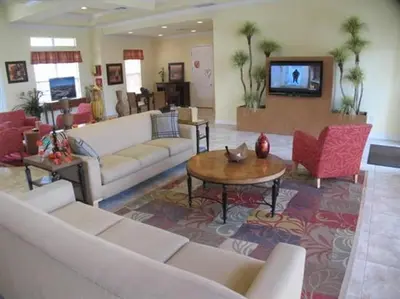 a large living room with couches and a tv at Cane Island Resort 2BR Condo, Close to Attractions in Kissimmee