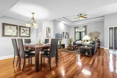 a dining room and living room with a table and chairs at Summer Fun Starts Here - Townhome by Disney! in Orlando
