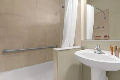 a bathroom with a sink and a toilet and a shower at Summer Fun Starts Here - Townhome by Disney! in Orlando