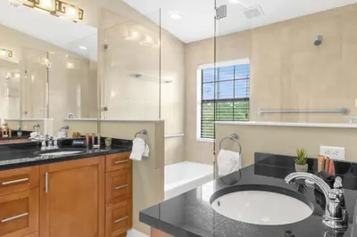 a bathroom with a sink and a shower and a tub at Summer Fun Starts Here - Townhome by Disney! in Orlando